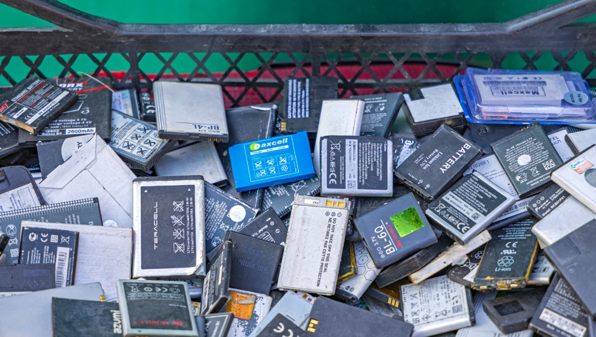 used batteries in recycling bin